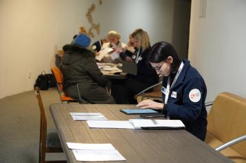 People at the table collecting data